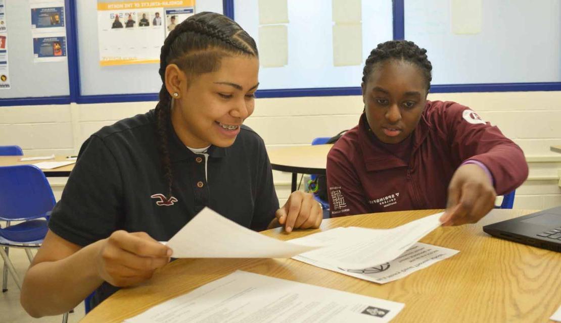 AmeriCorps teacher working with student