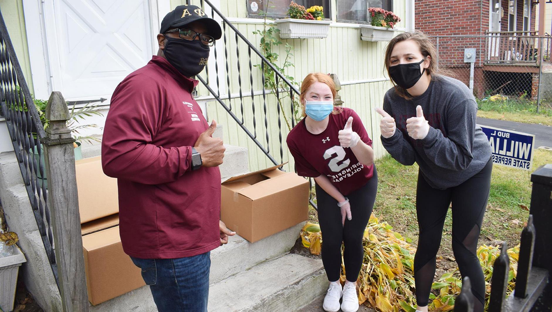 Vice President Calvin Hill and students delivery food