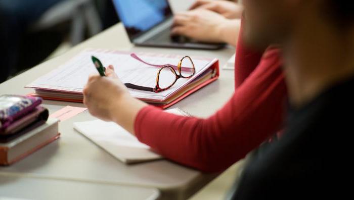 A student works on a paper in a Springfield College classroom.